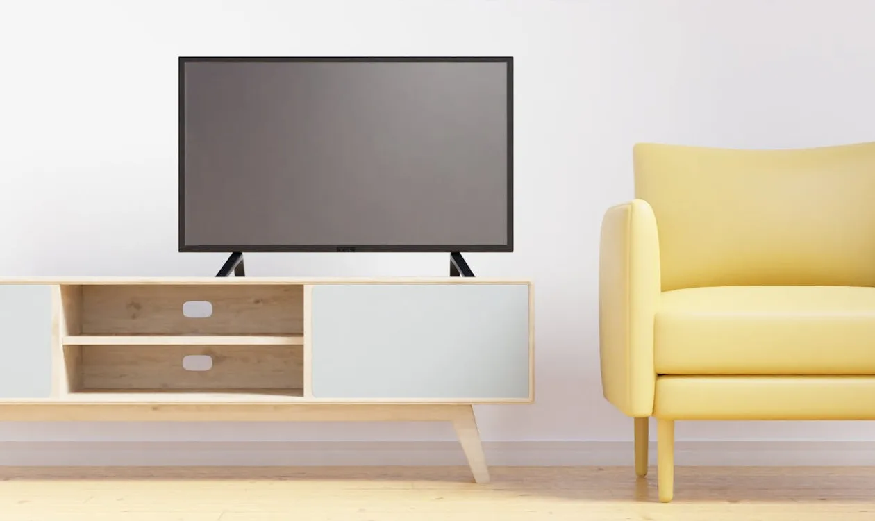 Flat-screen smart TV in a cosy living room displaying a vibrant 4K image