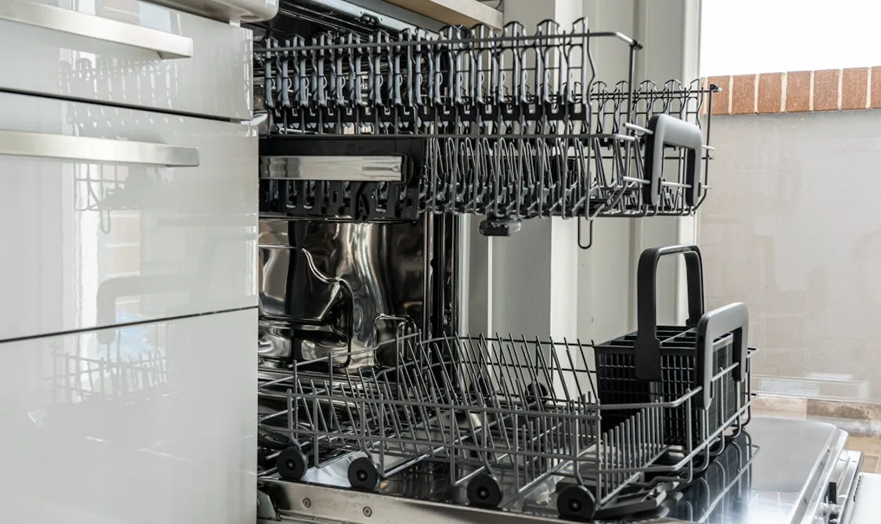 Modern stainless steel over-the-range microwave installed above a kitchen range