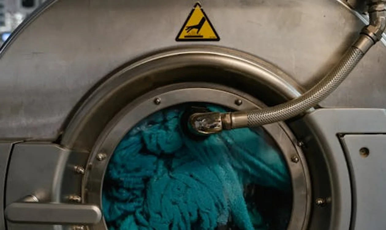 Modern stacked washer-dryer combo unit in a clean, bright laundry room