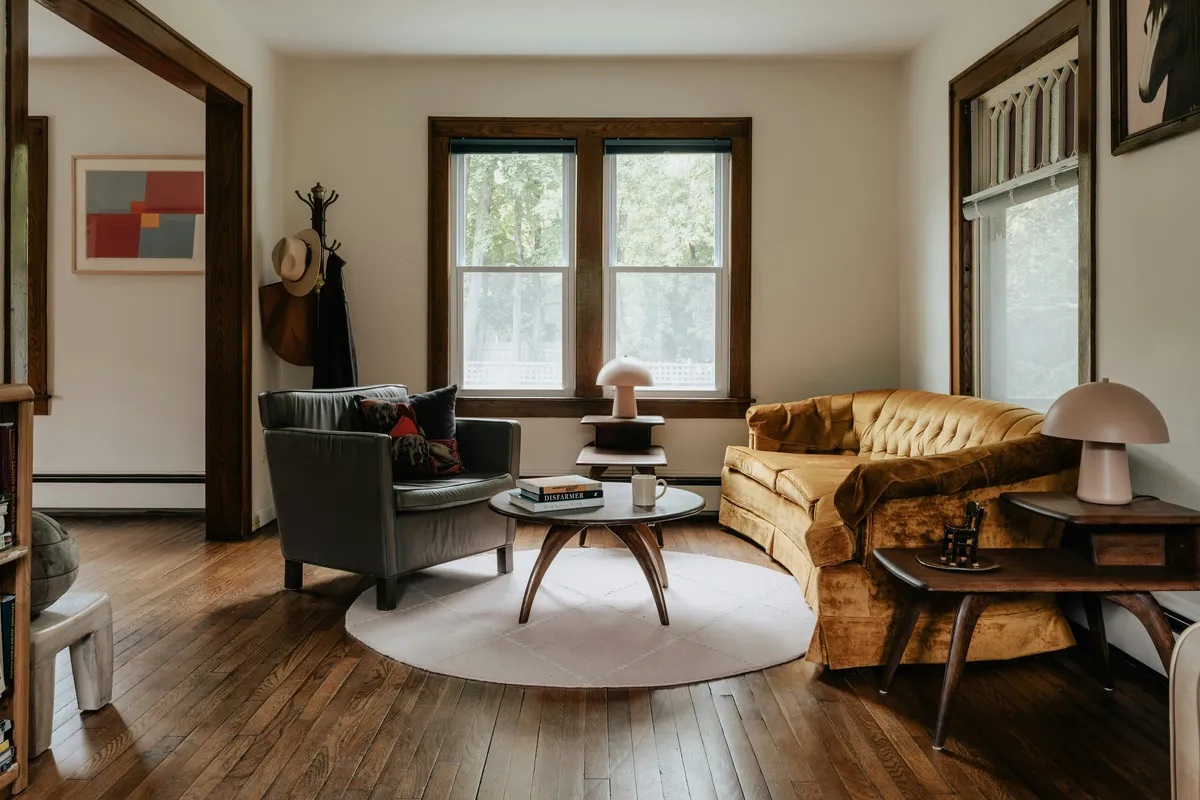 Bare wooden floor running through a furnished living room
