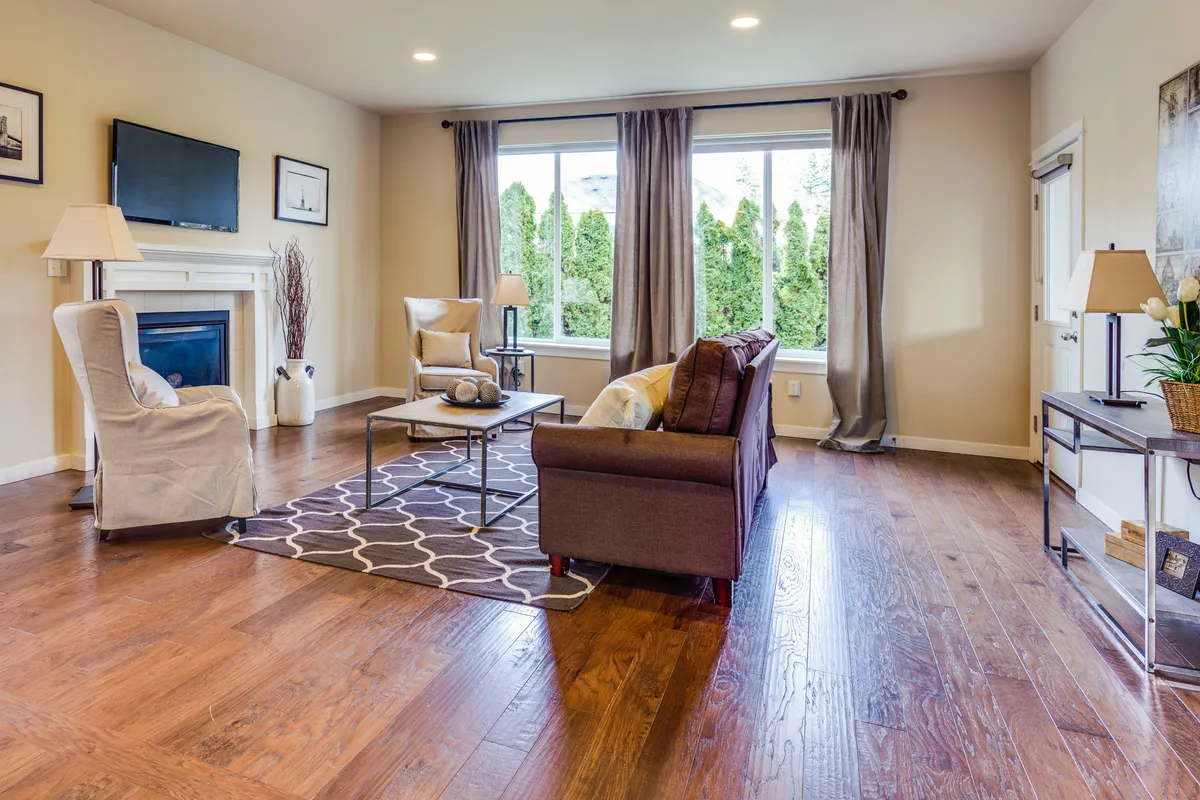 Open living room floor stretching toward a fireplace