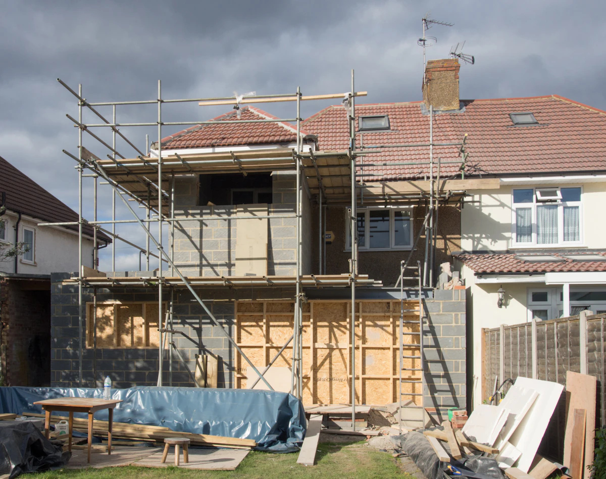 A part-built house extension with bare block and render walls