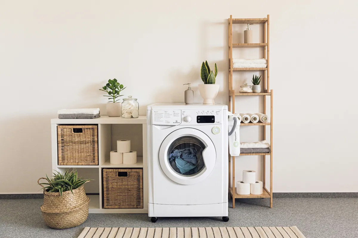 Washer and dryer pair installed side by side in a utility room