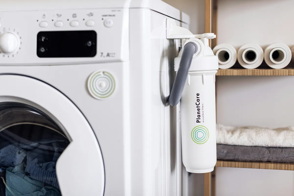 White front loading washing machine with its door closed