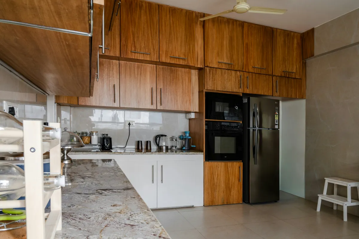 Kitchen corner with a refrigerator and a built in microwave