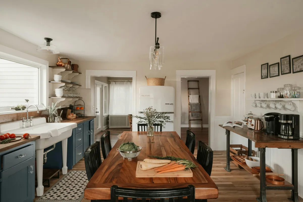 Farmhouse kitchen with an island and a dining table