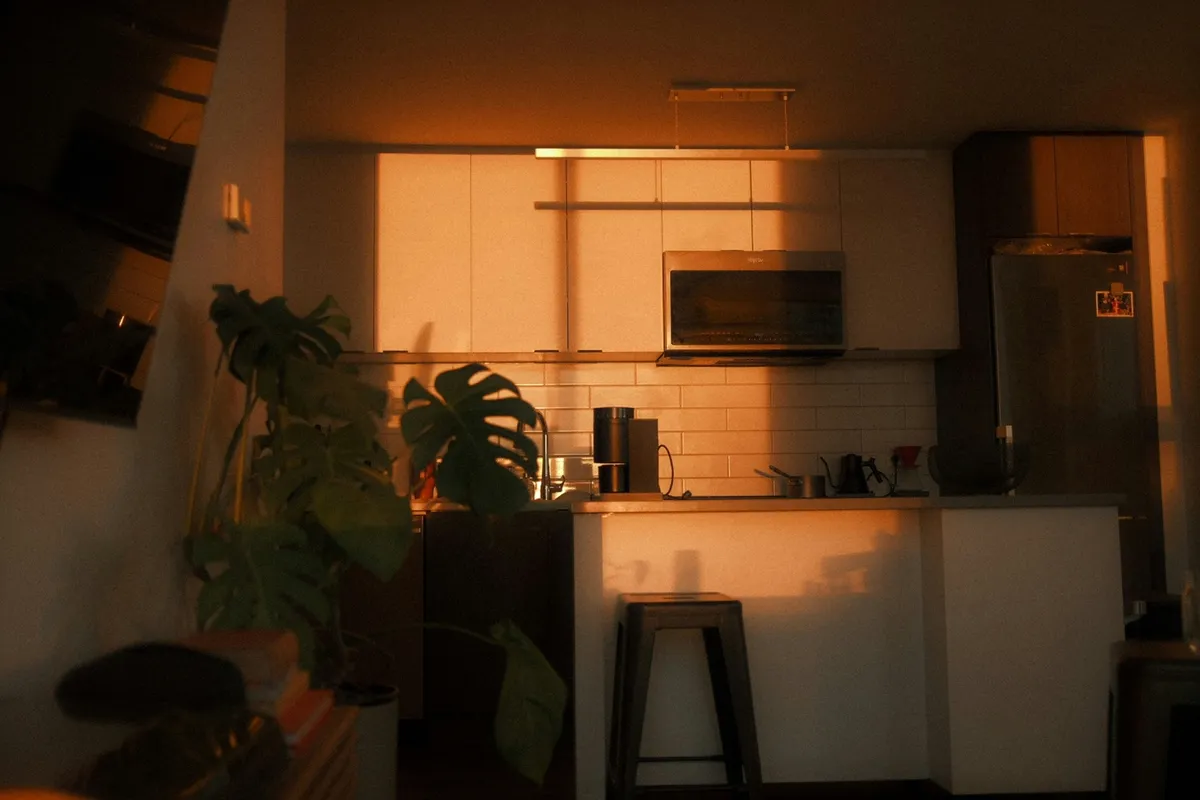 Kitchen lit by warm evening light across the counters