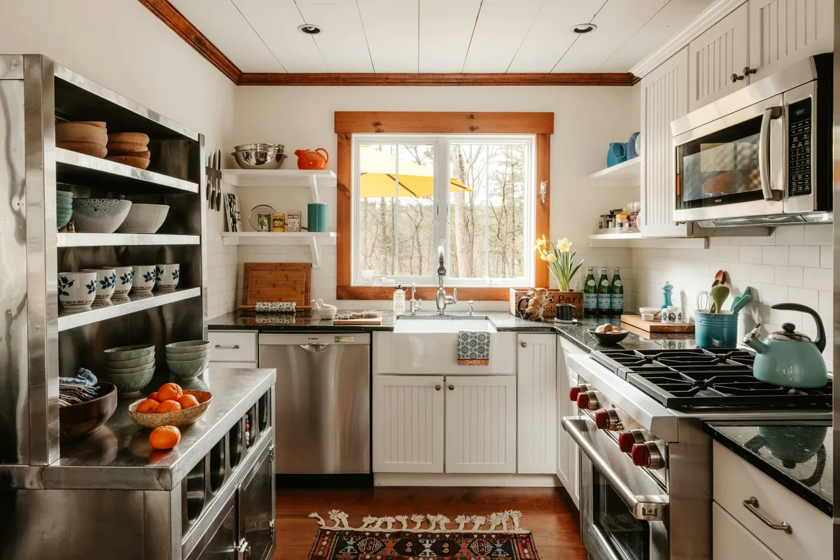 Cosy kitchen with stainless steel appliances and wooden accents
